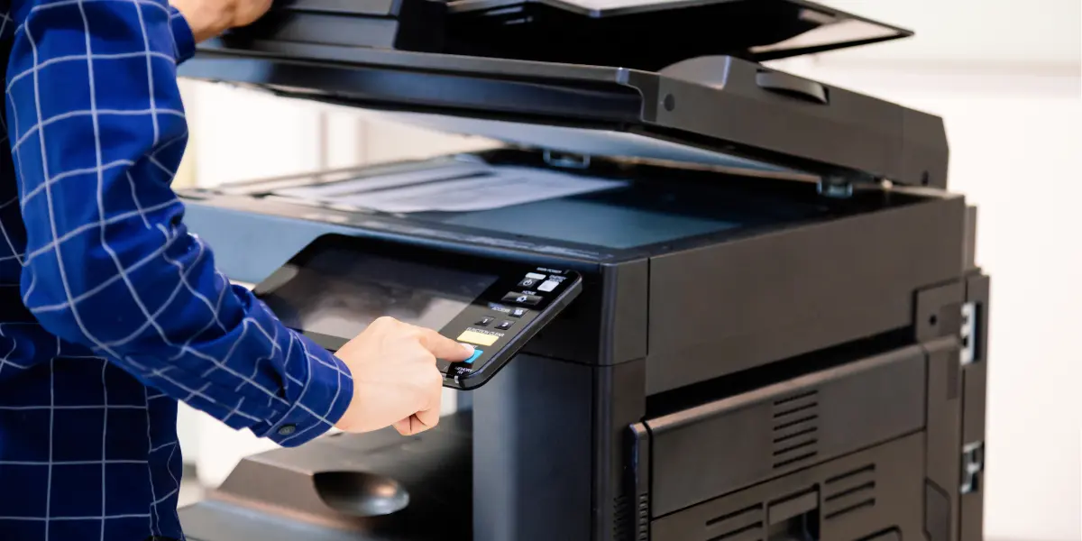 Person operating copy machine that is managed by Elevated Group