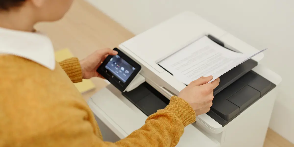 Business person operating company printer