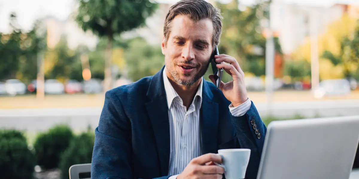 Man using his phone as a business phone with upgraded telecom unified communications